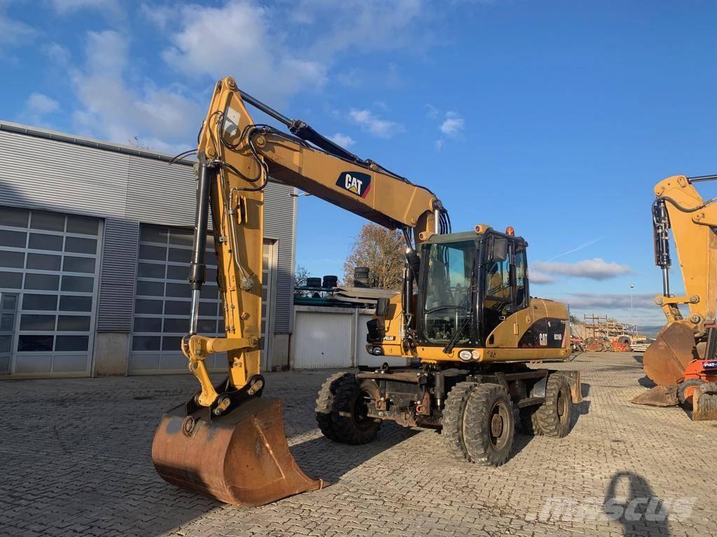 CAT M 316 D حفارات بعجل