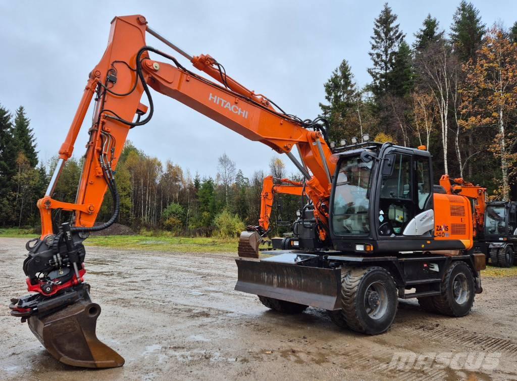 Hitachi ZX 140 W T-5 حفارات بعجل