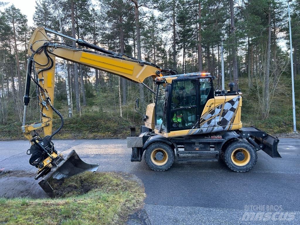 CAT M 317F حفارات بعجل