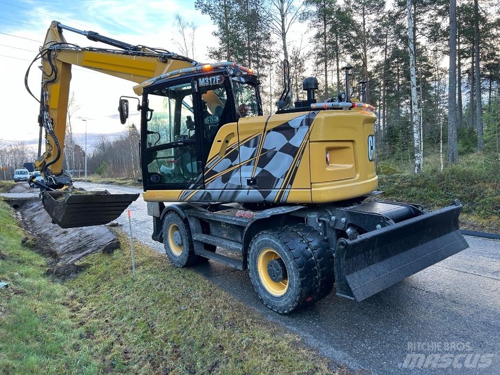 CAT M 317F حفارات بعجل