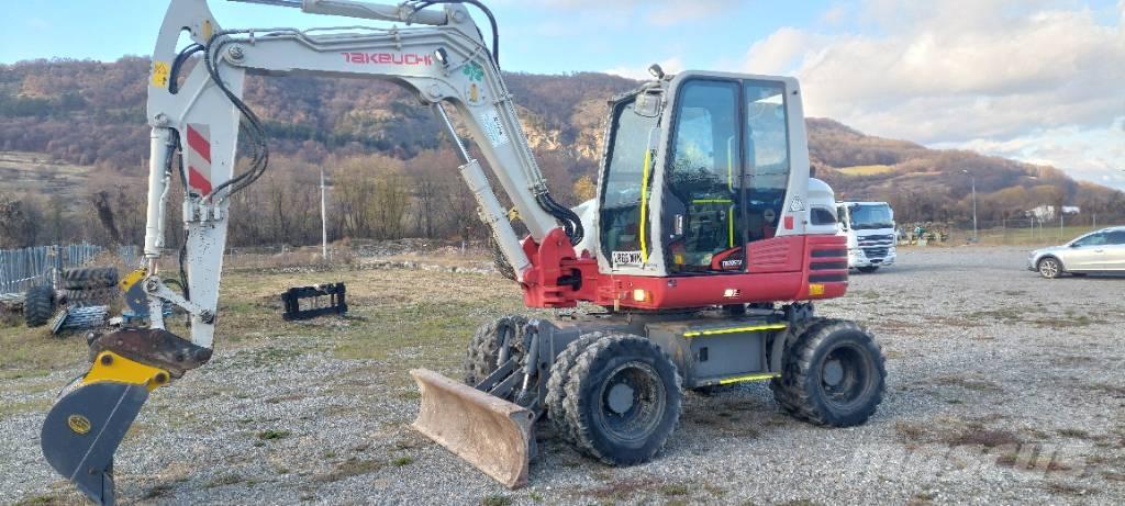 Takeuchi TB 295 W حفارات بعجل