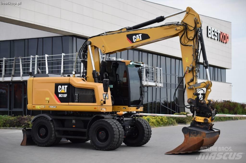 CAT M 318 F حفارات بعجل