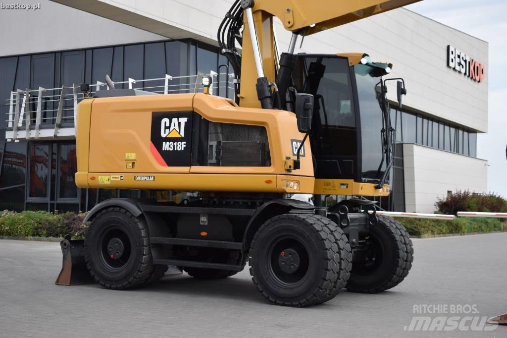 CAT M 318 F حفارات بعجل