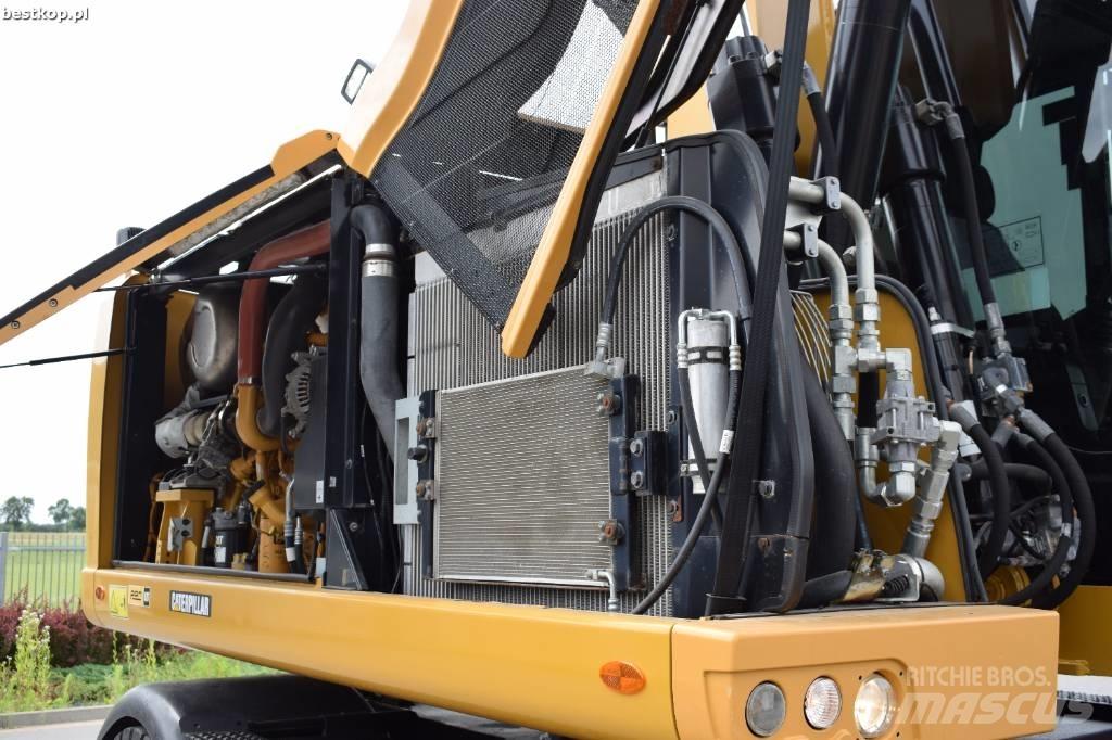 CAT M 318 F حفارات بعجل