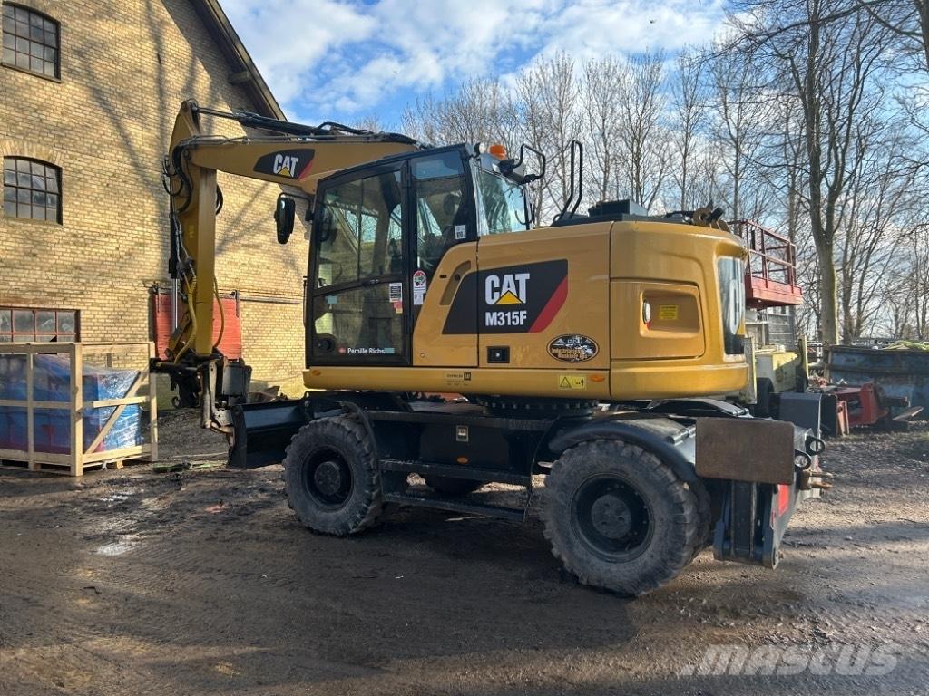 CAT M315F حفارات بعجل