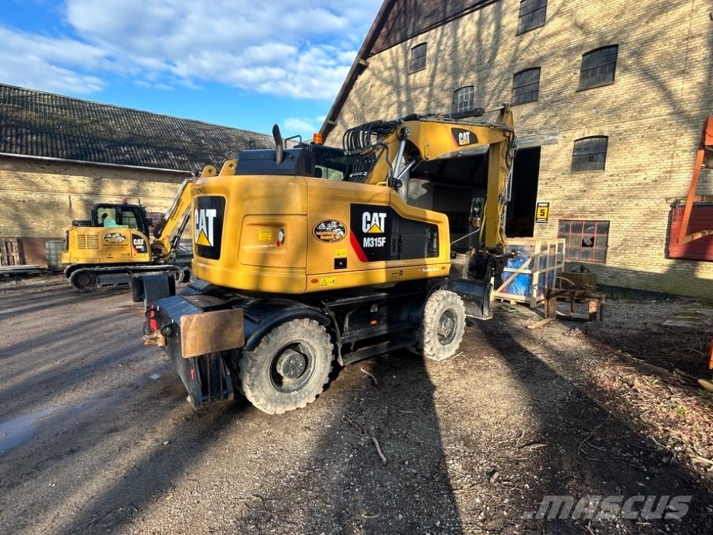CAT M315F حفارات بعجل