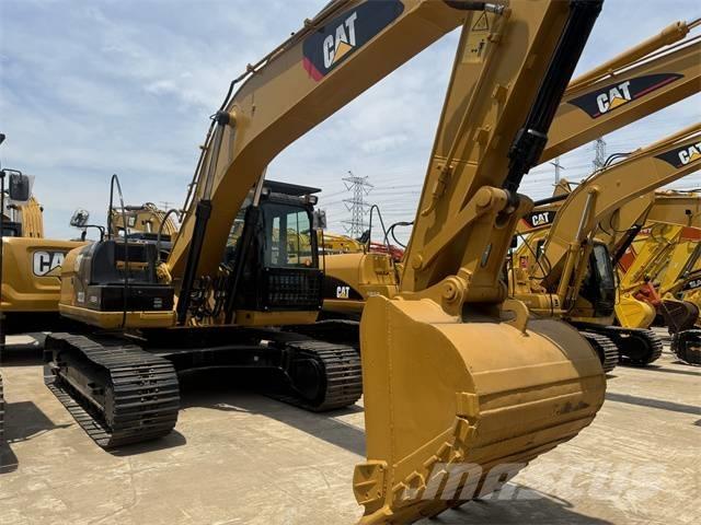 CAT 323 D L حفارات زحافة