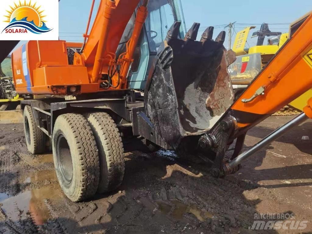 Hitachi EX 100 W D حفارات بعجل