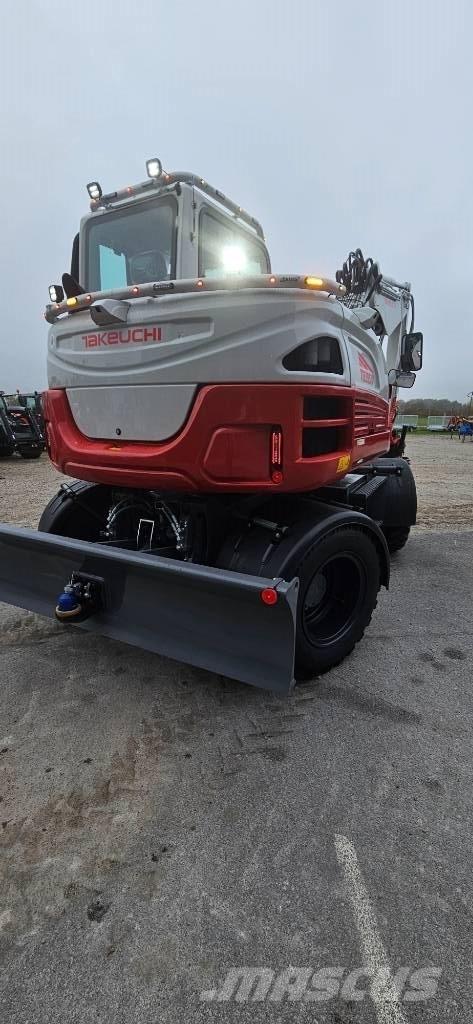 Takeuchi TB 395 W حفارات بعجل