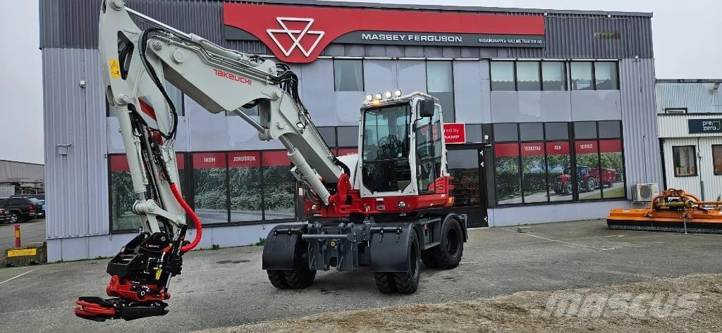 Takeuchi TB 395 W حفارات بعجل