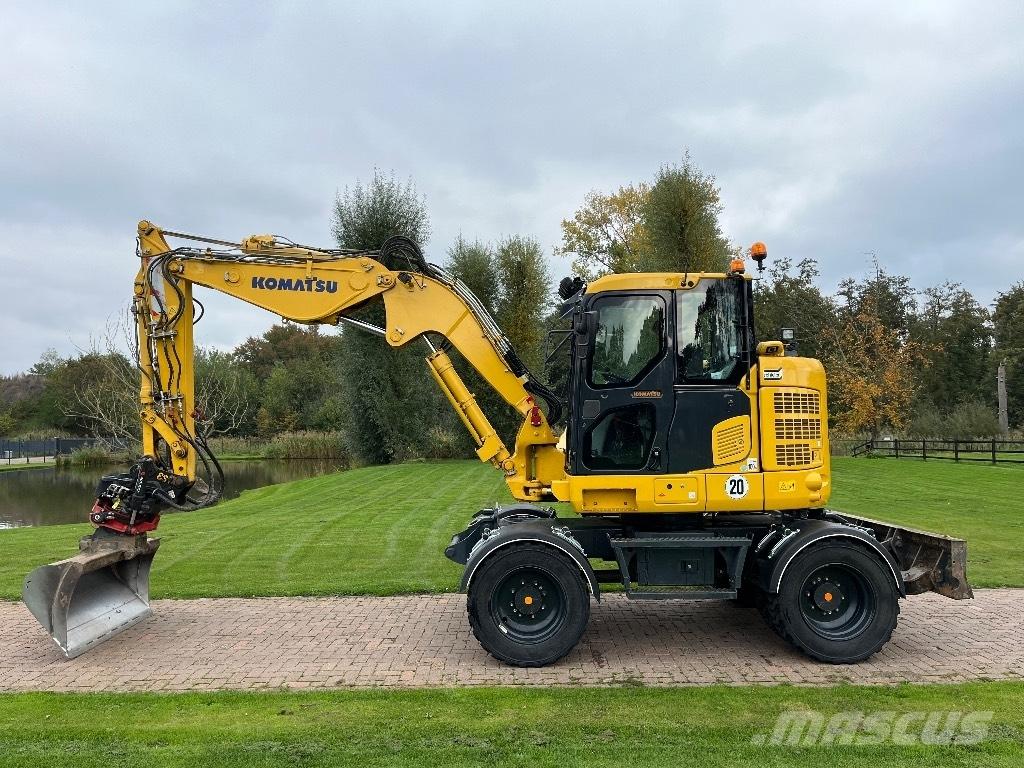 Komatsu PW 118 حفارات بعجل