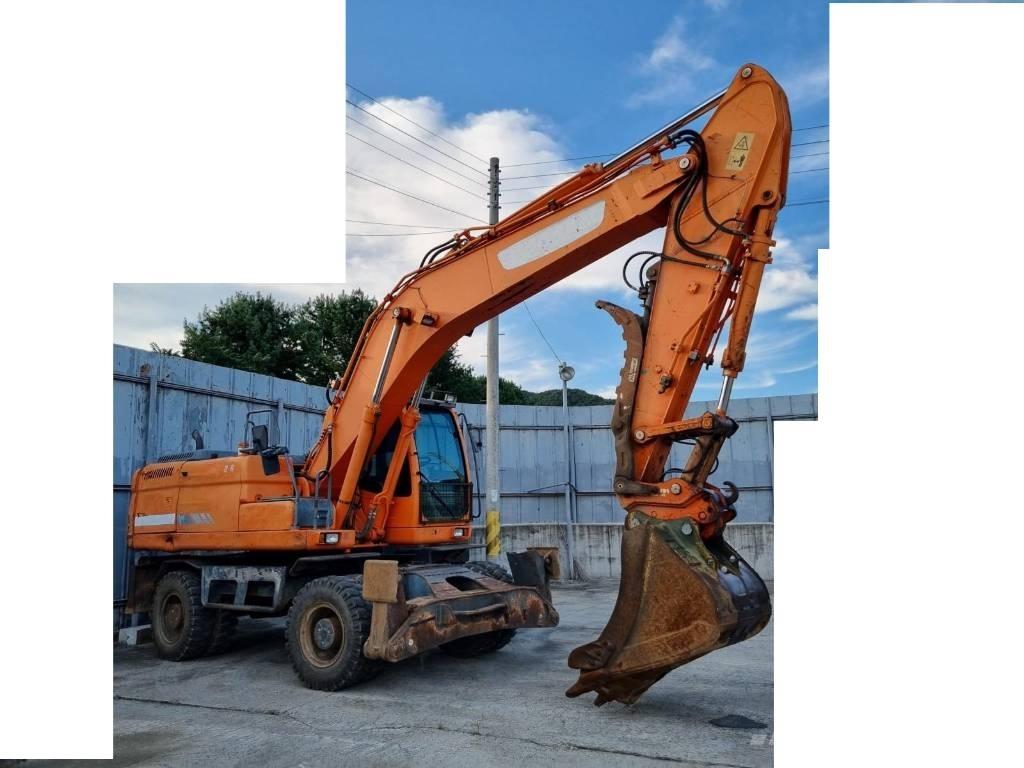 Doosan DX 210 W حفارات بعجل