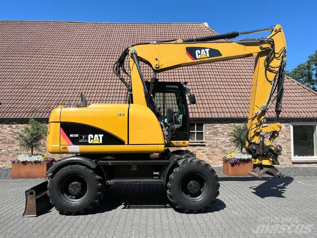 CAT M 313 D حفارات بعجل