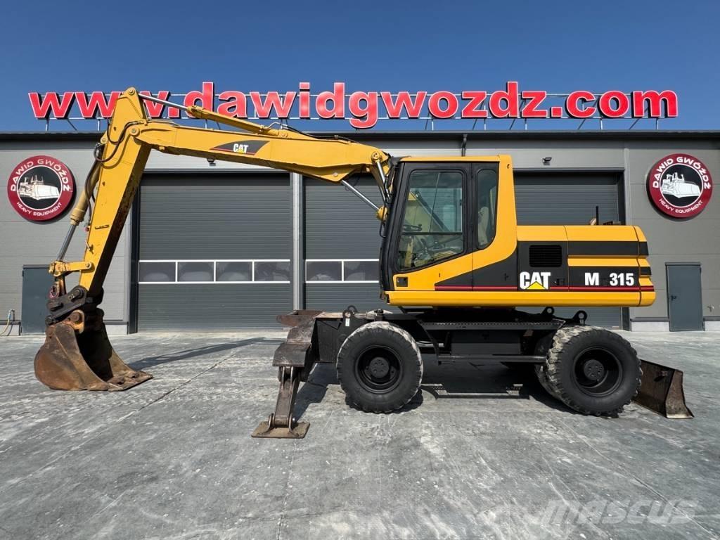 CAT M 315 حفارات بعجل