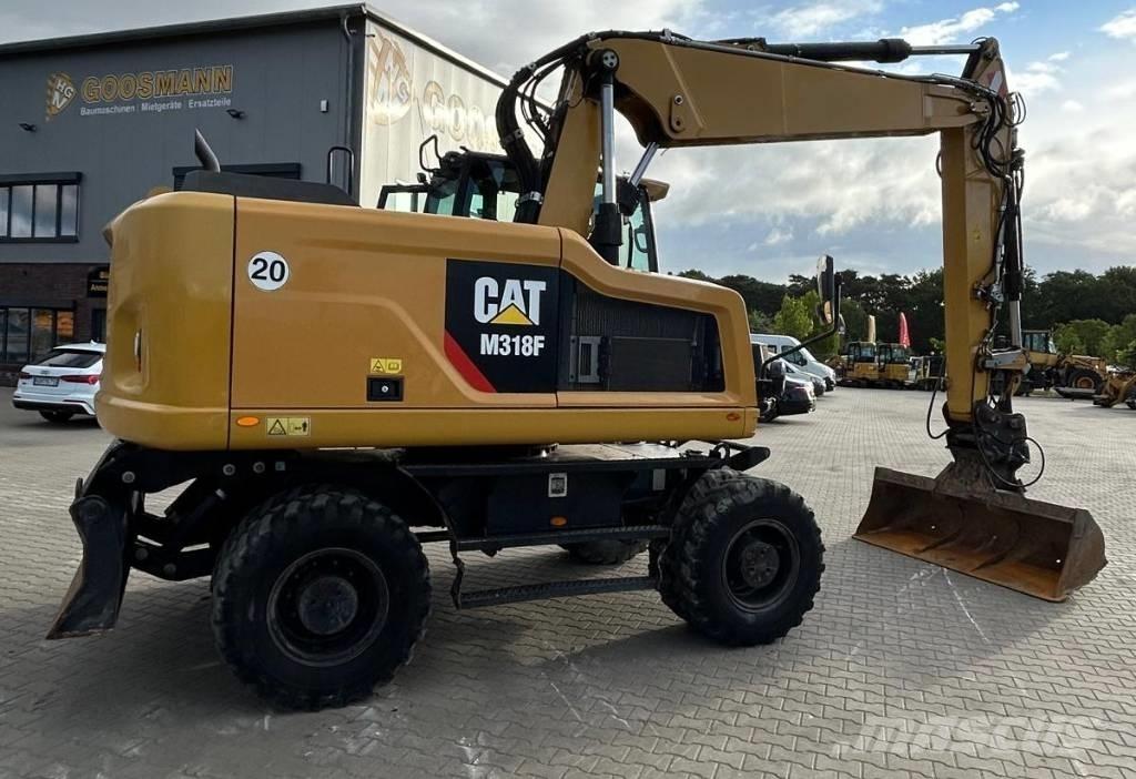 CAT M 318 F حفارات بعجل