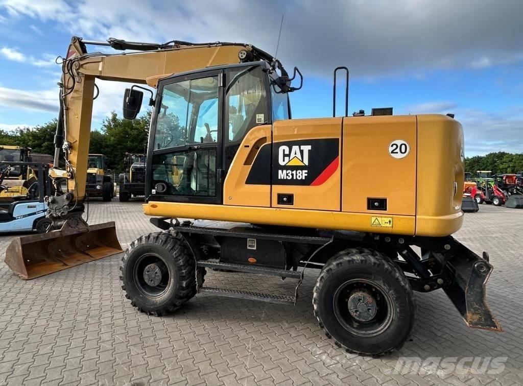 CAT M 318 F حفارات بعجل