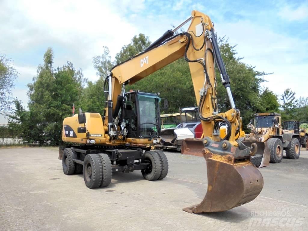 CAT M 316 D حفارات بعجل