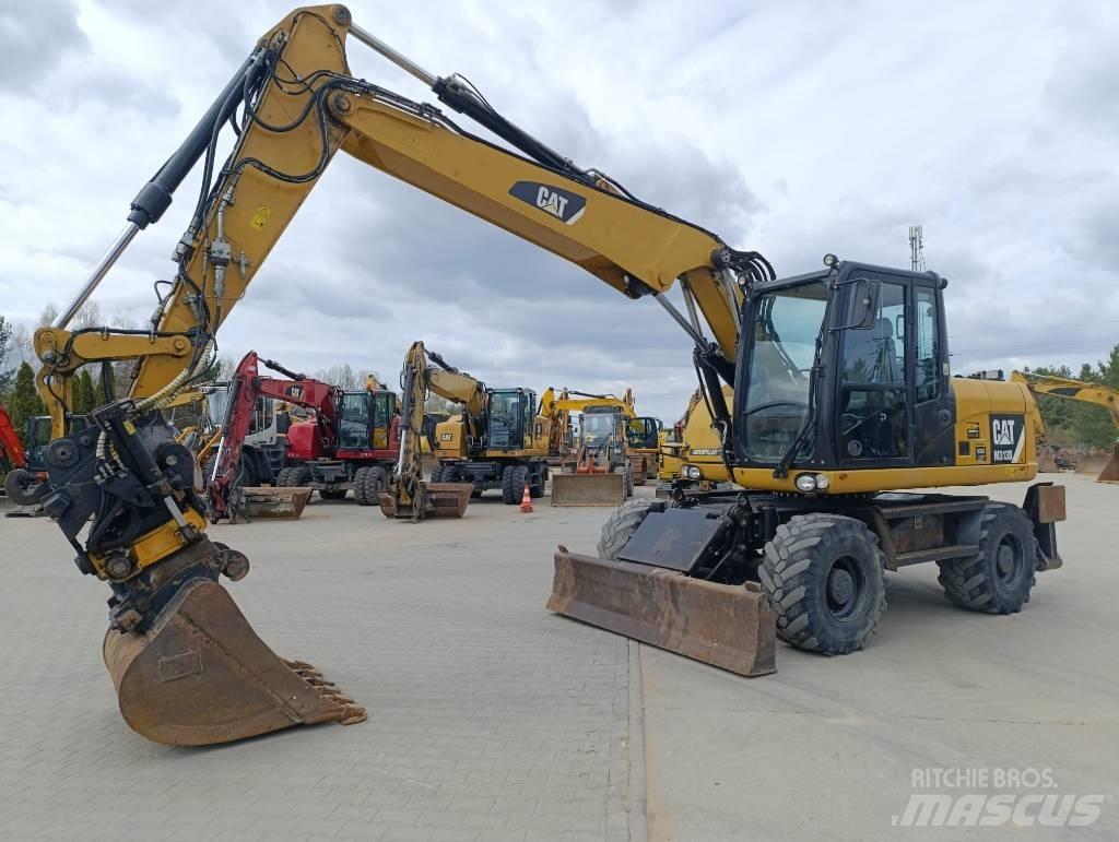 CAT M 313 D حفارات بعجل