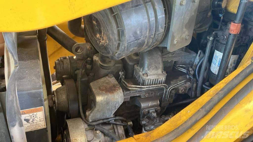 New Holland B 95 B لوادر ذات جرافات عكسية
