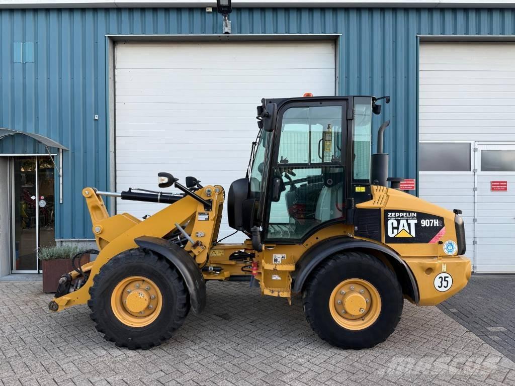 CAT 907 H لوادر بعجل