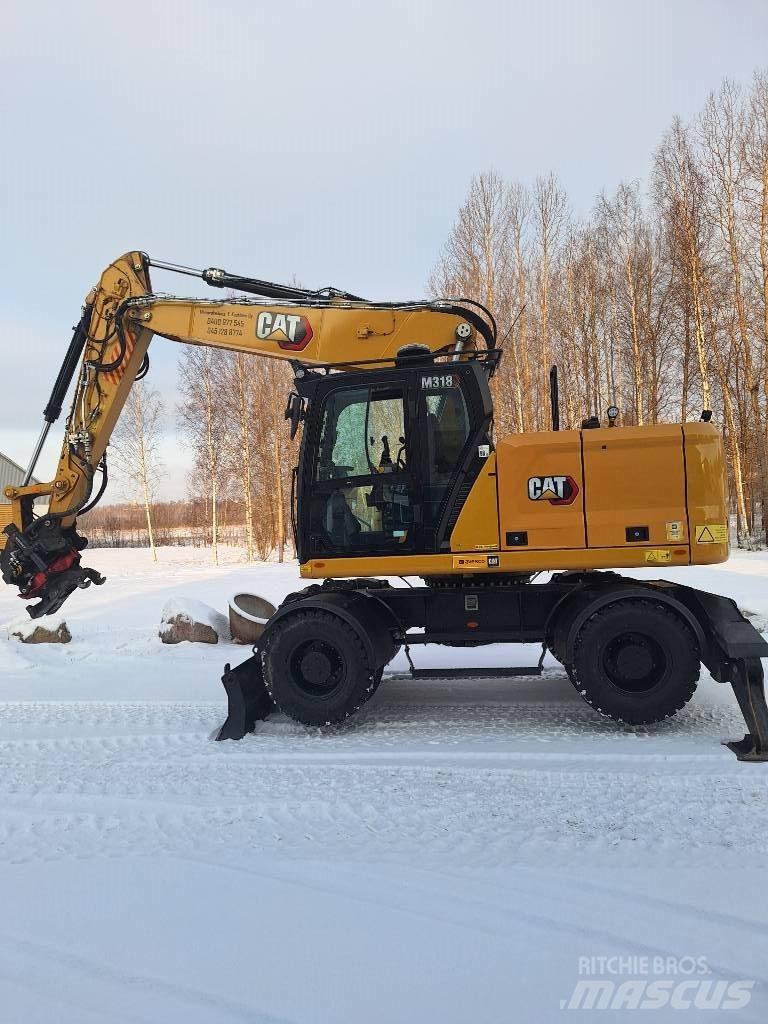 CAT M 318 حفارات بعجل