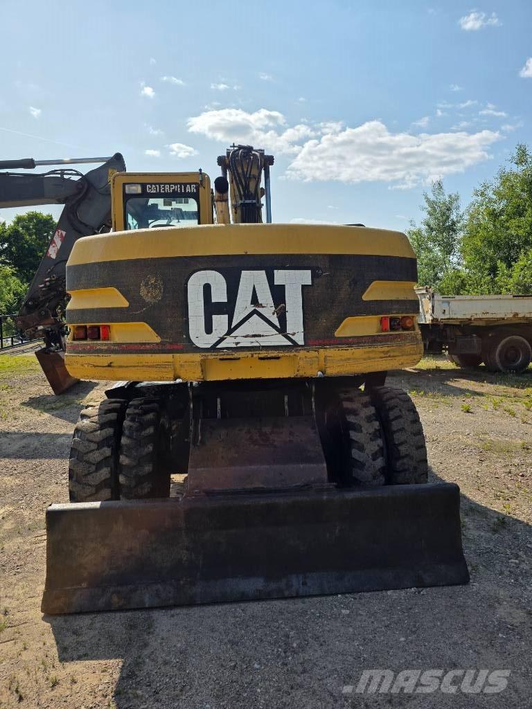 CAT 312 M حفارات بعجل