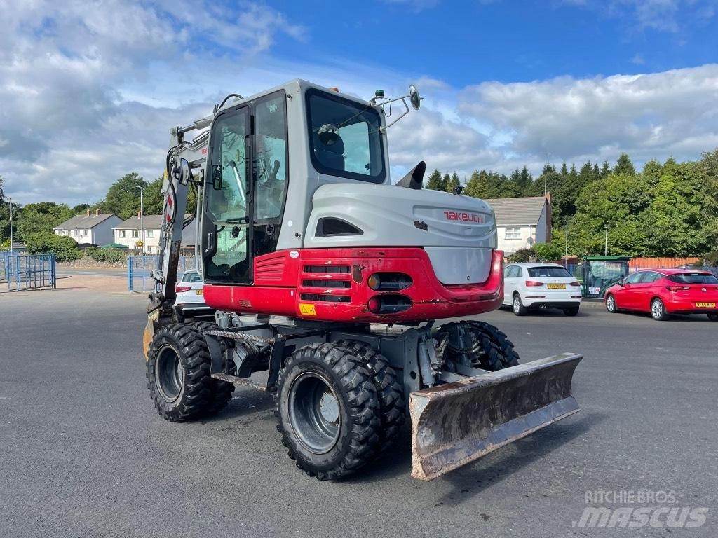 Takeuchi TB295W حفارات بعجل