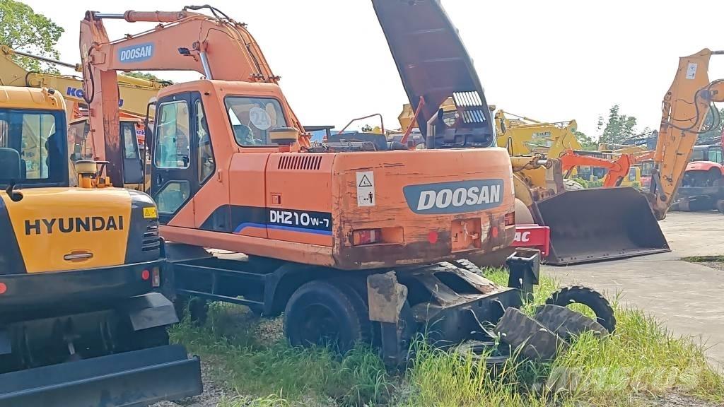 Doosan DH 210 W-7 حفارات بعجل