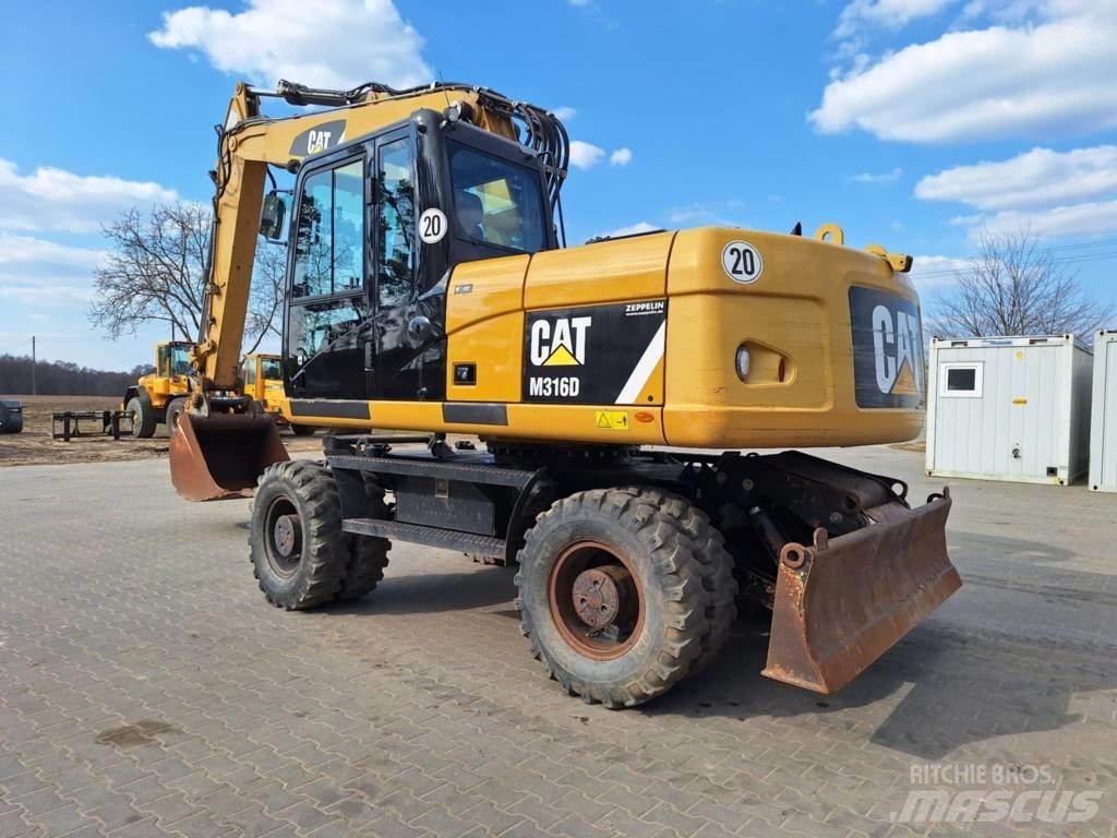 CAT M 316 D حفارات بعجل