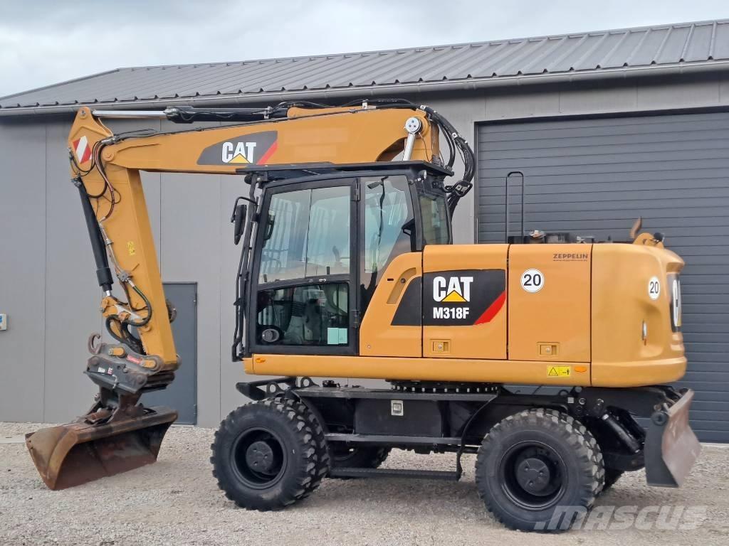 CAT M318F حفارات بعجل