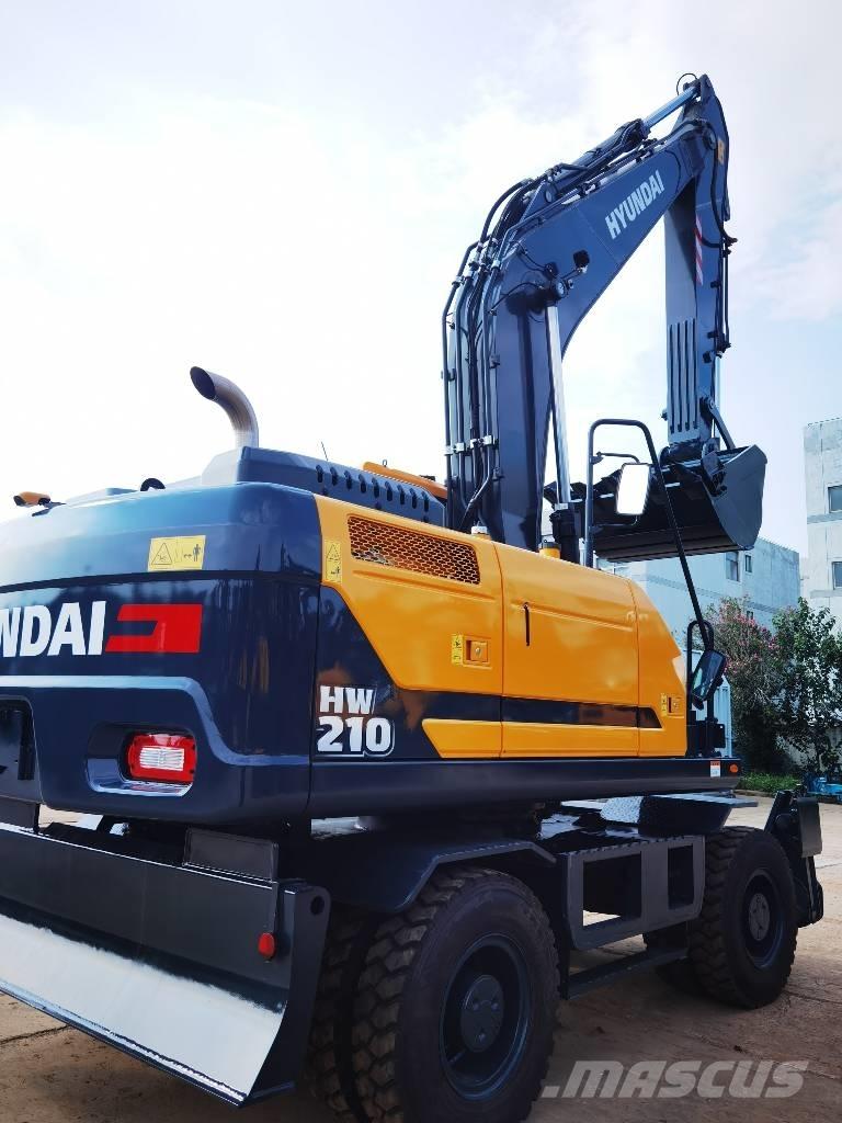 Hyundai 210W-9 حفارات بعجل