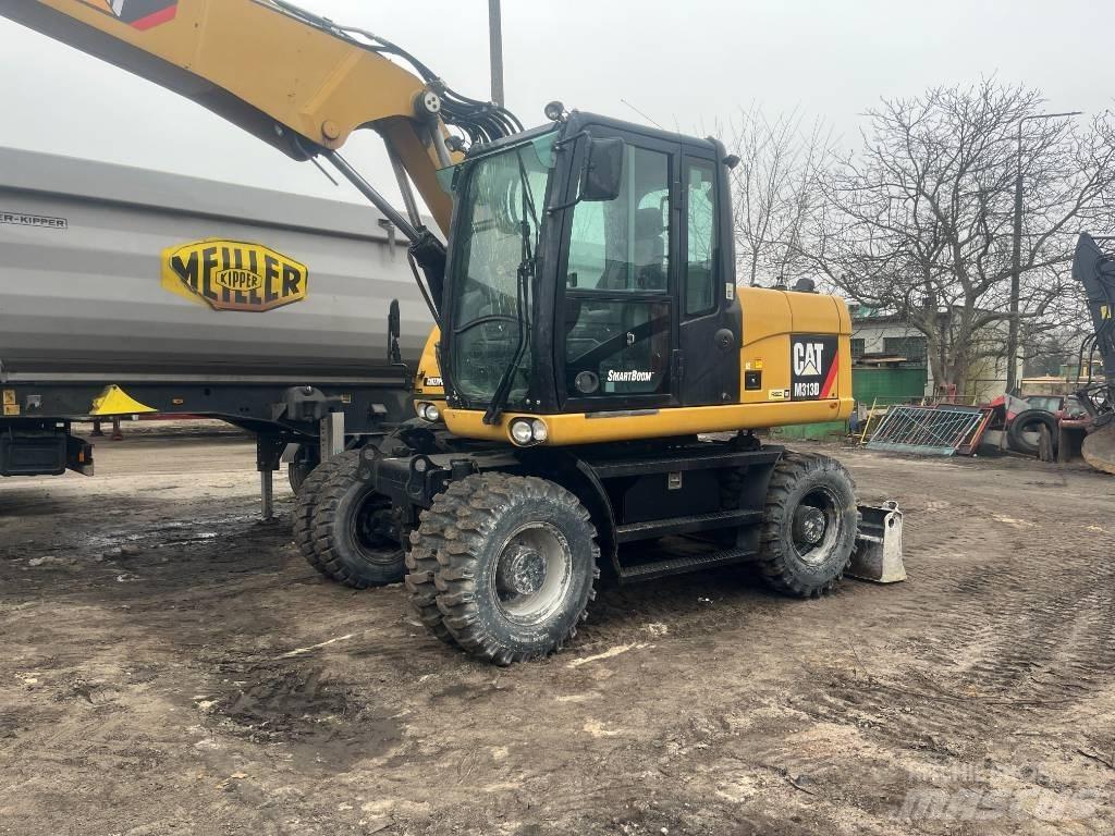 CAT 313 D حفارات بعجل