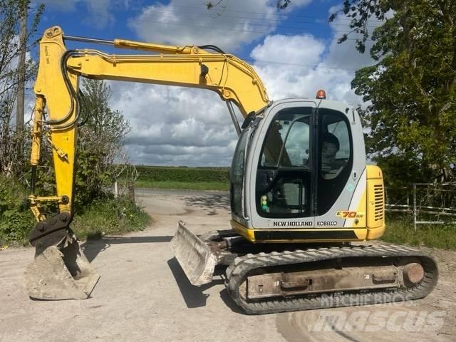 New Holland E 70 SR حفارات وسط 7 طن - 12 طن