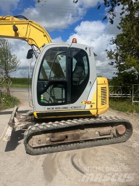 New Holland E 70 SR حفارات وسط 7 طن - 12 طن