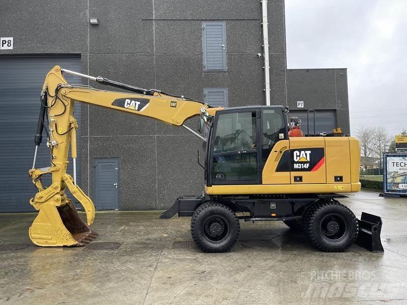 CAT M 314 F حفارات بعجل