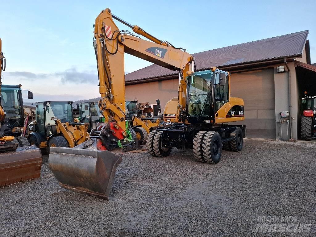 CAT M 316 C حفارات بعجل