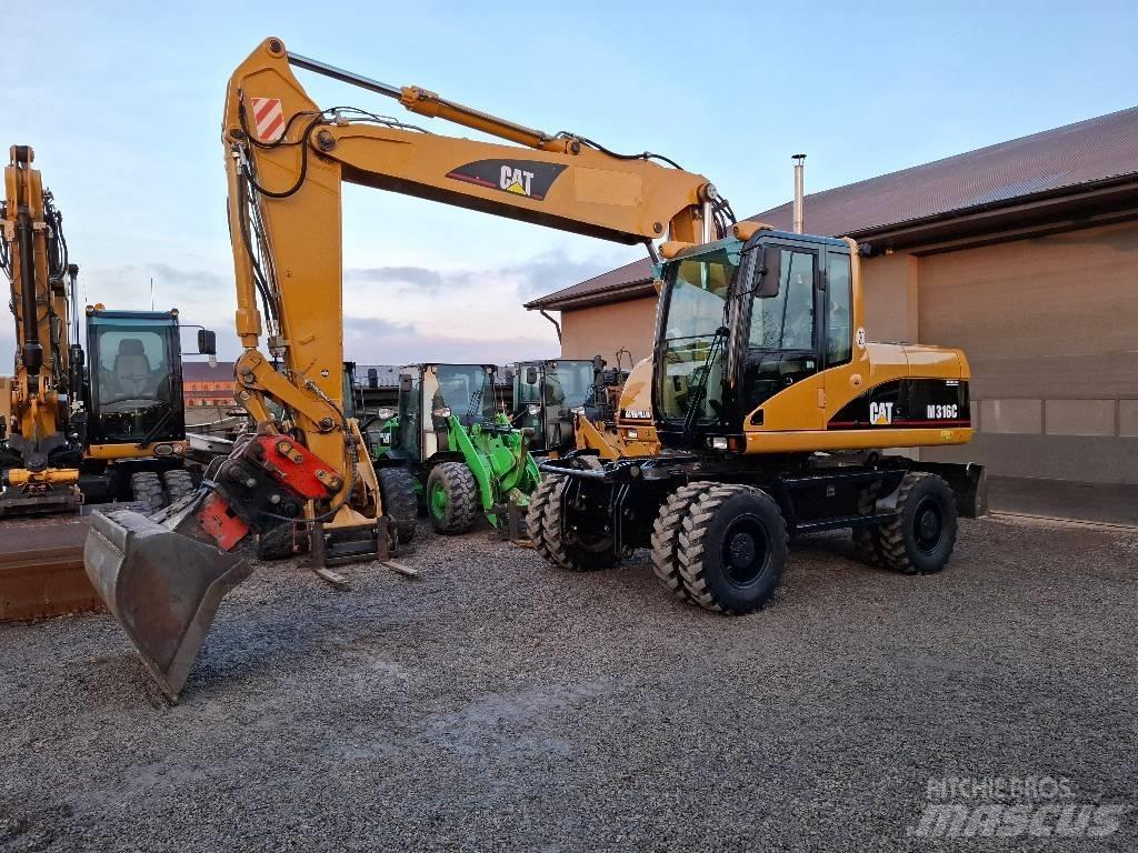 CAT M 316 C حفارات بعجل