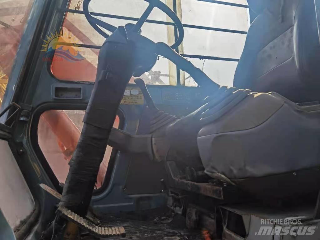 Hitachi EX 100 W D-2 حفارات بعجل
