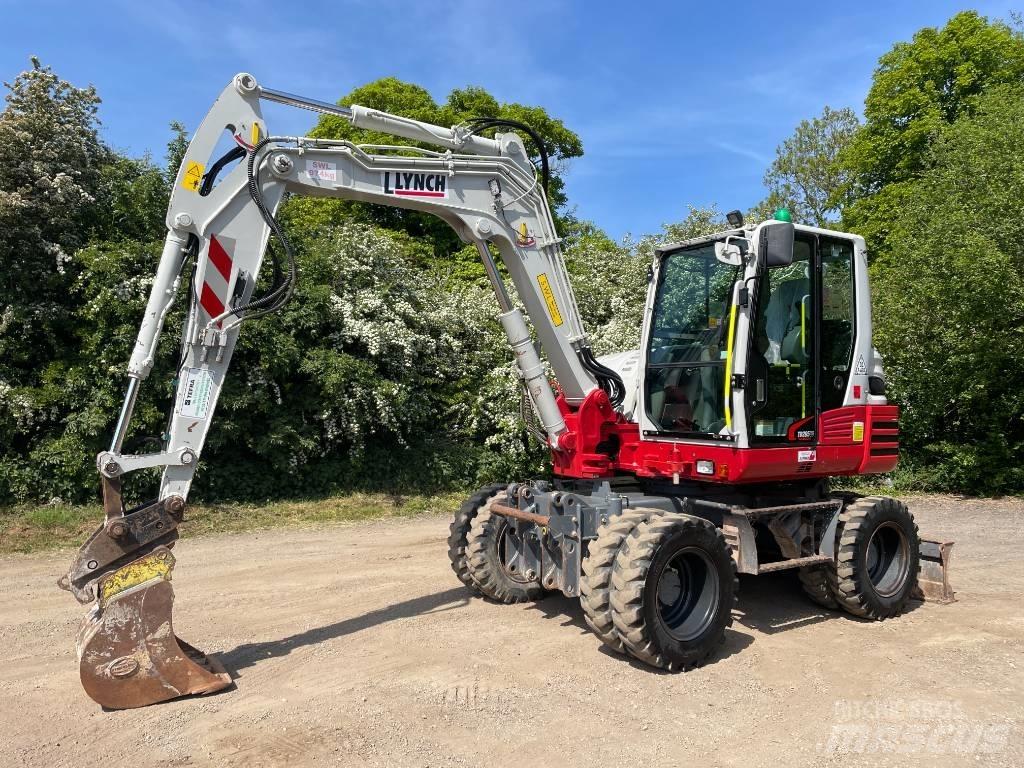 Takeuchi TB 295 W حفارات بعجل