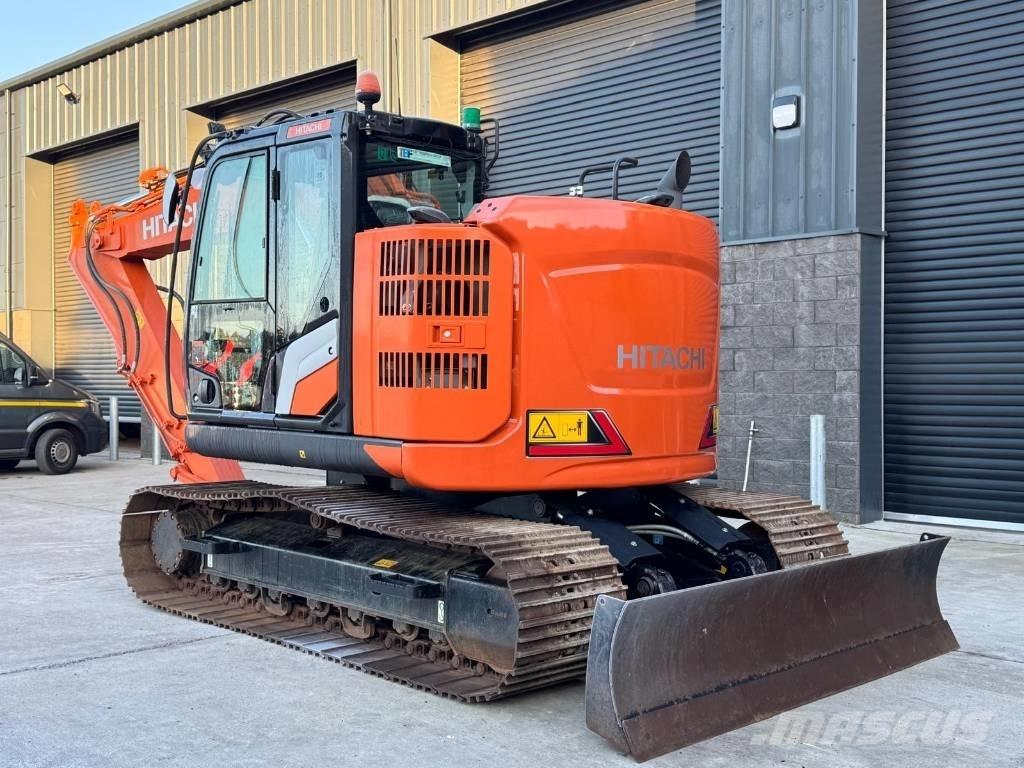 Hitachi ZX 135 US-7 حفارات زحافة