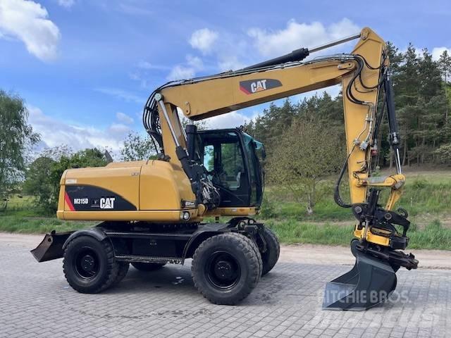 CAT M 315 D حفارات بعجل