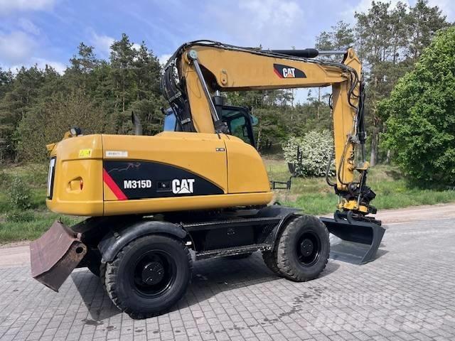 CAT M 315 D حفارات بعجل