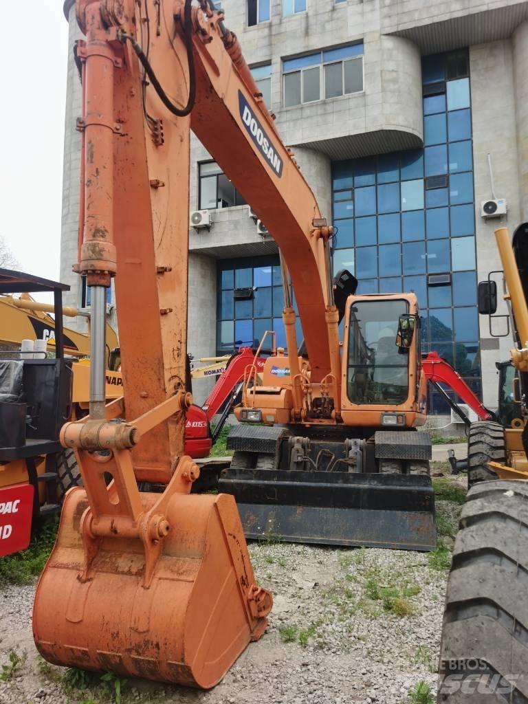 Doosan DH 210 W-7 حفارات بعجل