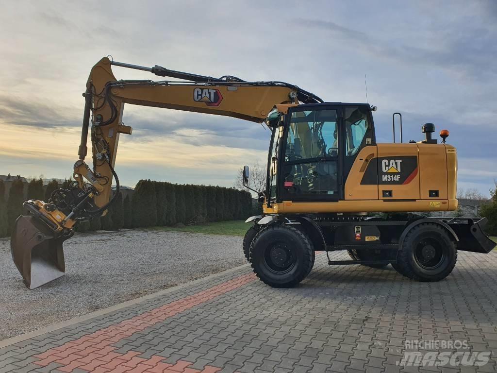 CAT M 314 F حفارات بعجل