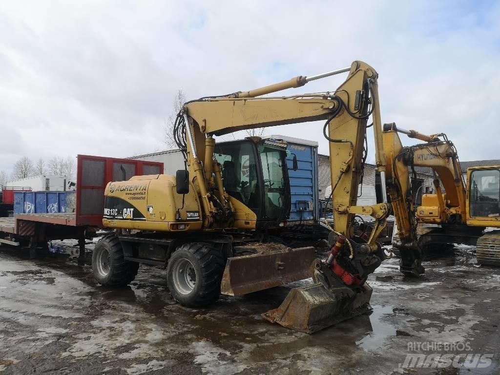 CAT 313 C حفارات بعجل