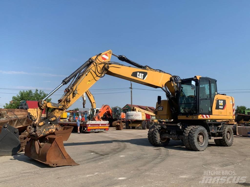CAT M 318 F حفارات بعجل