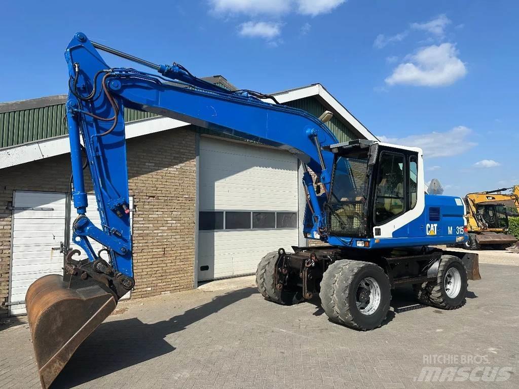 CAT M315 حفارات بعجل