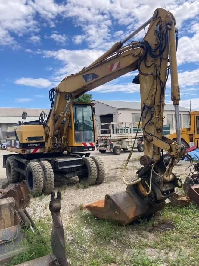 CAT M 312 حفارات بعجل