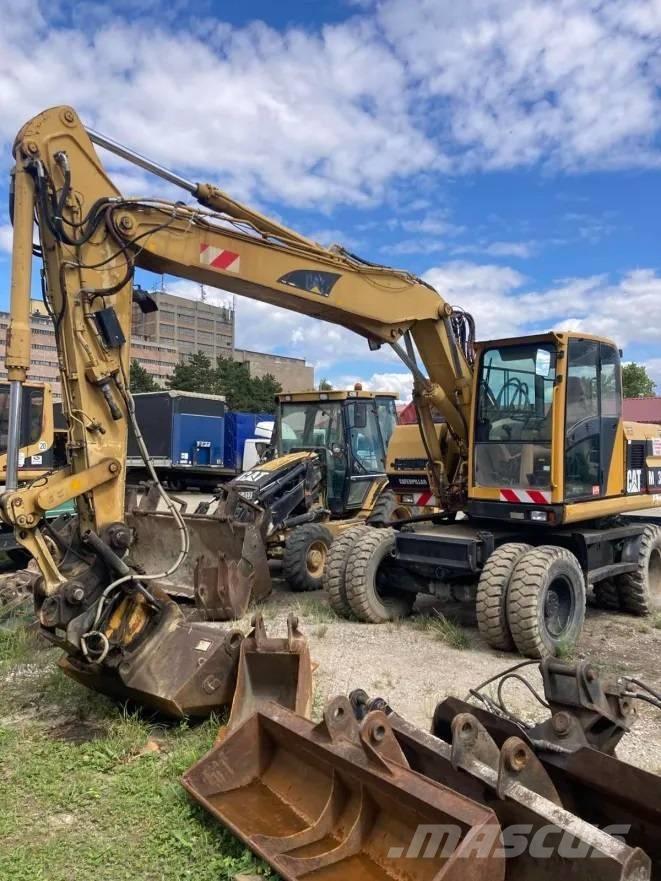 CAT M 312 حفارات بعجل