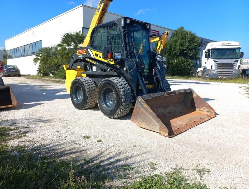 New Holland L320 لوادر انزلاقية التوجيه